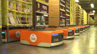 Cum muncesc robotii cot la cot cu oamenii intr-un depozit Amazon (Video)